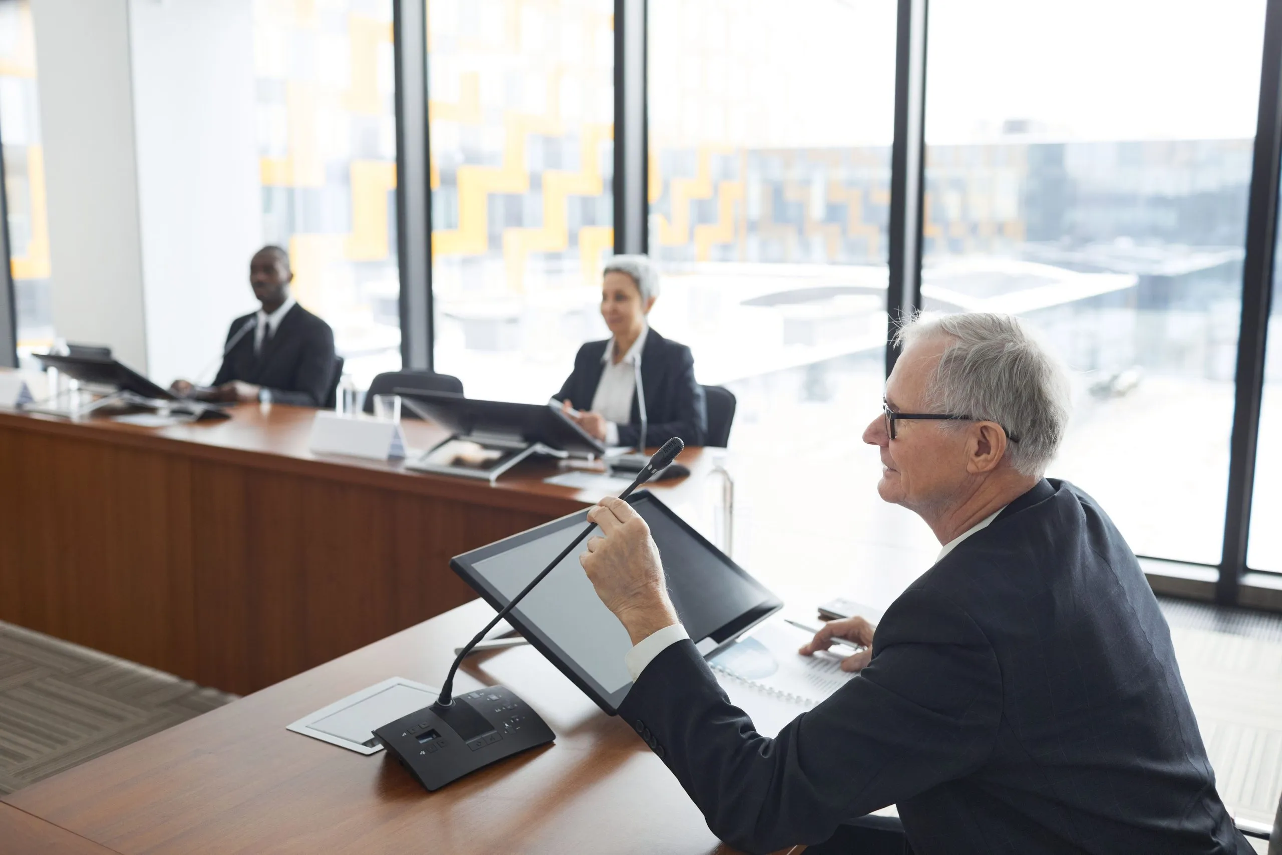 pexels-werner-pfennig-6949478-1-scaled-cmp Photo of an arbitration tribunal with a single arbitrator, two persons from a of party.